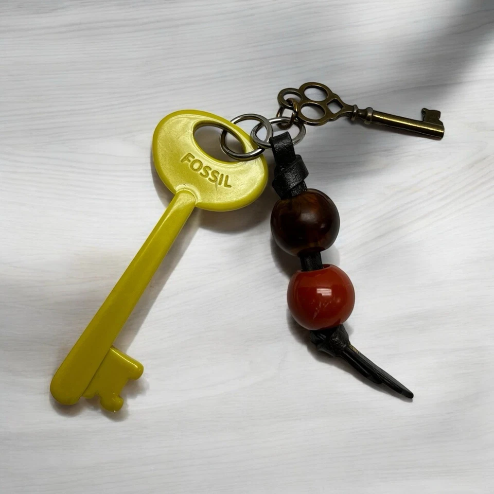 Dijes de bolsa de llaves Fossil Keyper cuentas grandes esqueleto etiqueta colgante repuesto Foto 2 de 4