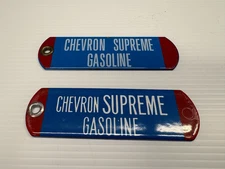 PAIR OF VINTAGE CHEVRON SUPREME GASOLINE PORCELAIN TAG OIL SIGNS