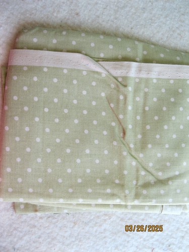 Pale greenish tan with white polka dots from Fabric Traditions