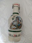  DECORATED  BOTTLE  WITH HANDLE AND STOPPER HAS SOME WEAR & TEAR SEE PHOTOS 