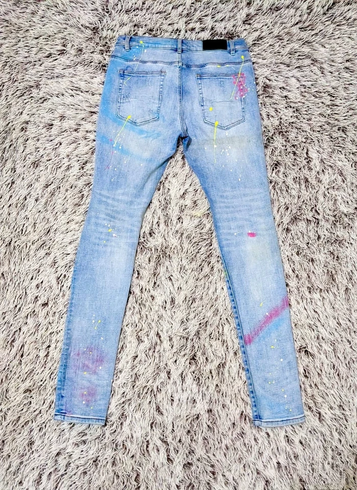 Jeans salpicados de pintura multicolor azul claro Amiri - 34 EE. UU. Foto 2 de 4