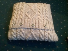 a grey hand knitted cushion in aran wool with inner brand new a bargain