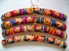 Set of 4 good quality padded clothes hangers with Multicoloured 60's style girls