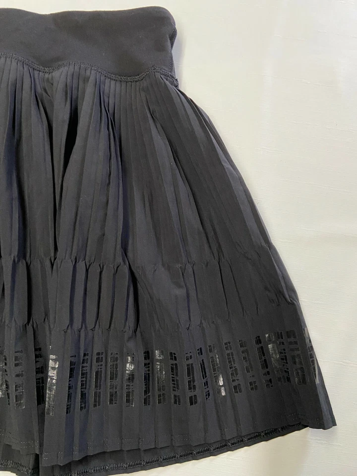 Pantalones Cortos Niñas IVIVVA Negros Forrados Sprint Completo Plisado Skort Talla 12 Foto 2 de 4