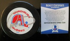 DALE HUNTER SIGNED QUEBEC NORDIQUES HOCKEY PUCK BECKETT BAS COA T23161