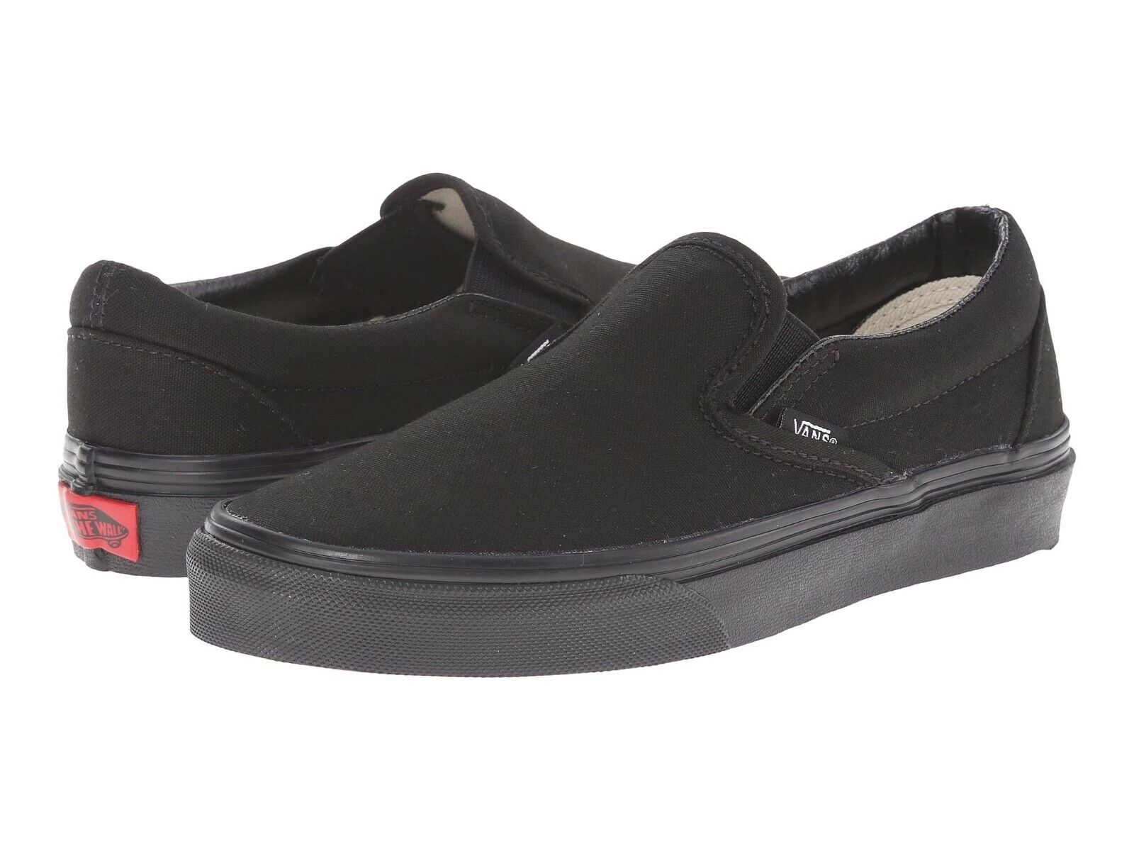 all black slip on vans mens