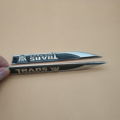 Par Emblema de Coche Metal Negro Transformers Cuchillo Guardabarros Insignia Pegatina - Imagen 4 de 6