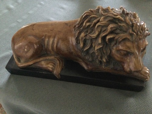 SLEEPING LION CHALKWARE FIGURE on a BASE