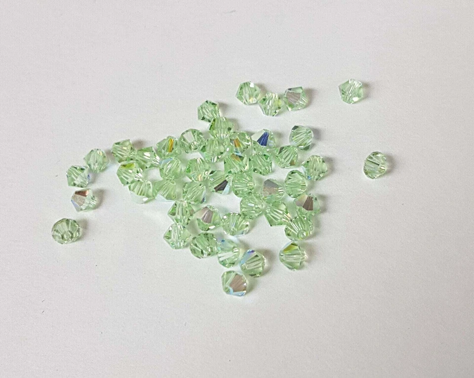 144x SWAROVSKI 5328 CRISTAL AB 4mm BICONO XILION ABALORIO Foto 4 de 4