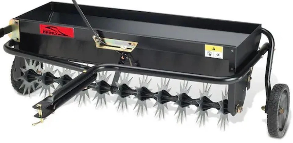 Ruedas de aireador de espiga de remolque Brinly-Hardy ejes de dientes de acero macizo Foto 2 de 4