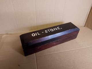 Vintage sharpening honing stone in original wooden case
