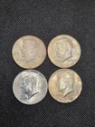 Four (4) 1964 AU KENNEDY 90% SILVER HALF DOLLARS