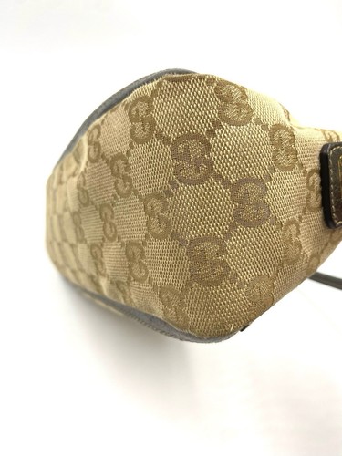 Mini bolso Gucci GG de lona con asa superior de abadía - Imagen 10 de 10