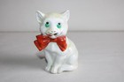 Antique breaking piggy bank, cat with bow, German porcelain, height 10 cm