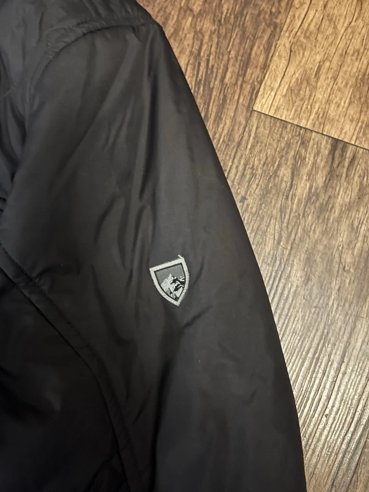 Chaqueta aislante de peso medio grande acolchada negra Kuhl Rebel para hombre Foto 3 de 4