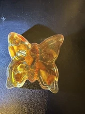 Epoxy Resin butterfly figure with amber pieces.