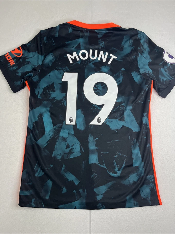 CAMISETA DE FUTBOL DEL CHELSEA 2021 2022 TERCERA CAMISETA NIKE DB5894-468 talla L HOMBRE #19 MONTURA Foto 2 de 4