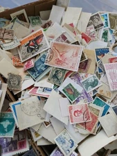 1500+ (2.3 OZ ) World used /mint 95% off Paper Postage Stamps. Box #2  READ!!