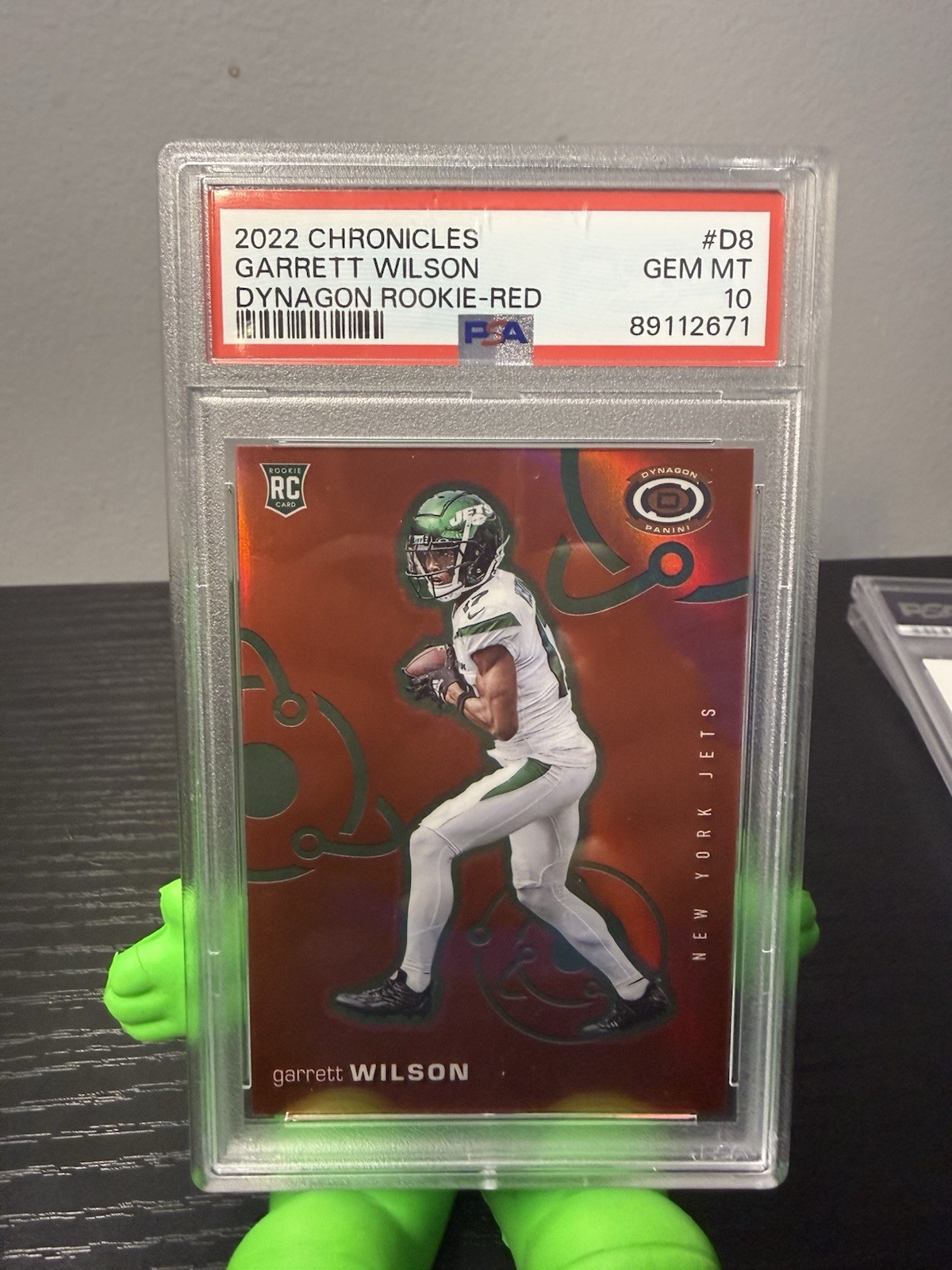 2022 Panini Chronicles - Dynagon Rookies Garrett Wilson #D-8 Red /99 (RC)