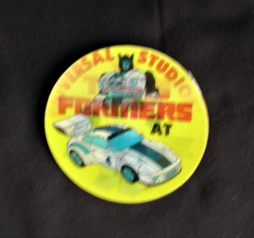 UNIVERSAL STUDIOS TRANSFORMERS Pin Back botón doble imagen de colección RARO N/M Foto 2 de 4