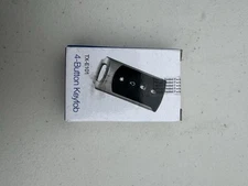 New Interlogix TX-E101 Four Button Chrome Wireless Keyfob LED