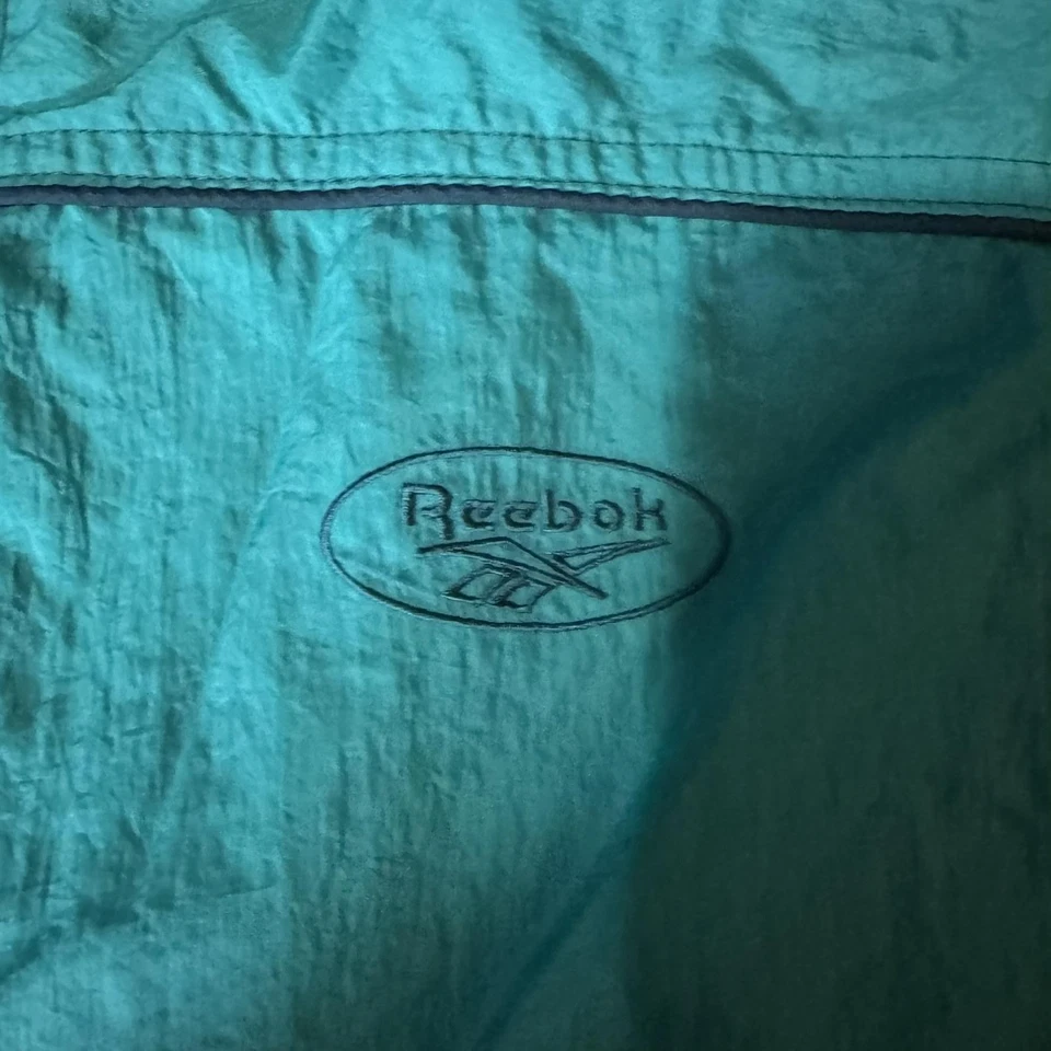 Chaqueta cortavientos vintage Reebok para hombre mediana verde azulado nailon cremallera completa malla forrada años 90 Foto 3 de 4