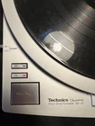 Technics SP-25 Turntable with a Technics ProBase and a Shure Tonearm.