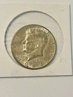 1964 KENNEDY HALF DOLLAR. GOOD STRIKE AU NICELY TONED 90% SILVER