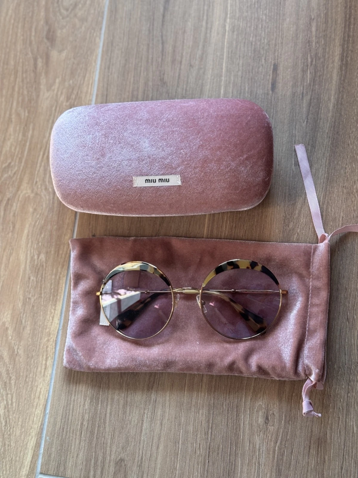 Occhiali da sole rotondi Miu Miu