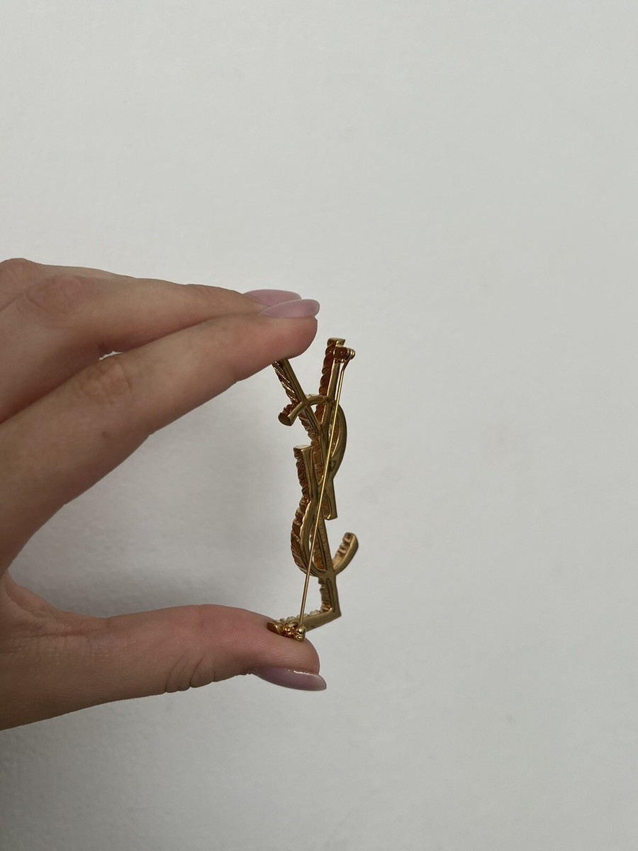 【Saint Laurent】 Opyum YSL brooch Opyum YSL brooch in gold - Saint Laurent | Mytheresa