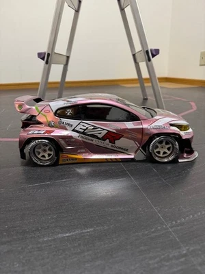 GR Yaris 1/10 Addiction EVA R Pink RC Car with Rear Wing & Metal Wheels - Image 1 of 4