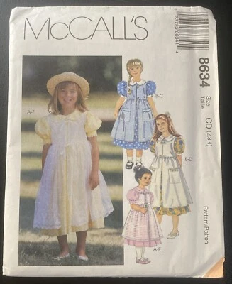 McCalls 8634 Dress & Pinafore Girls Sewing Pattern Uncut Sizes 2 3 4 - Image 1 of 4