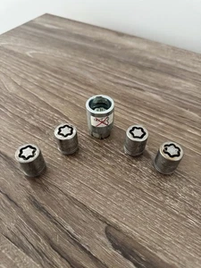 USED BAG INFINITI NISSAN OEM WHEEL LOCK SET Part # 999H1-A7003 - Picture 1 of 3