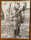 Handsome military man wearing gas mask, man laughing gay int Vintage photo