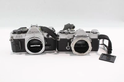 SLR Film Cameras Mechanically Working Inc Olympus, Canon Bodies Only x2 - Image 1 of 4