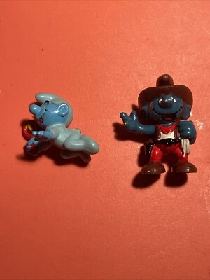 Lote de figuras de PVC vaquero Baby Pitufo azul con sonajero vintage 1984 Schleich Peyo 2" Foto 1 de 4