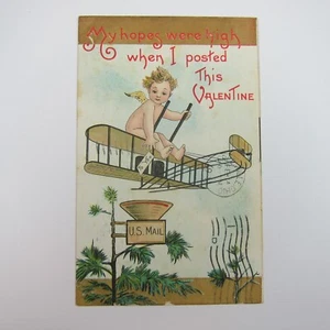 AK Valentinstag Amor fährt Doppeldecker Flugzeug über Briefkasten Baum Antik 1911 - Bild 1 von 12