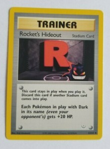 ROCKET'S HIDEOUT 63/64 Neo Revelation Trainer Pokemon Card Light Play