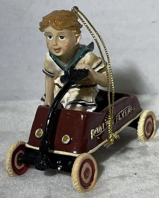 Radio Flyer Colgante Adorno de Navidad 2001 Niño Riding Wagon Vacaciones Foto 1 de 4