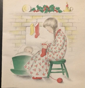 Vtg Christmas Greeting Card Girl In Braids Knitting Stocking Baby In Cradle Fire - Picture 1 of 2