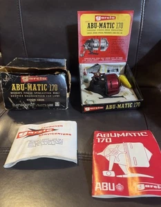 Mulinello vintage Abu Matic 170 INUTILIZZATO IN SCATOLA ORIGINALE ESPOSITORE SCATOLA È STATO BAGNATO - Foto 1 di 11