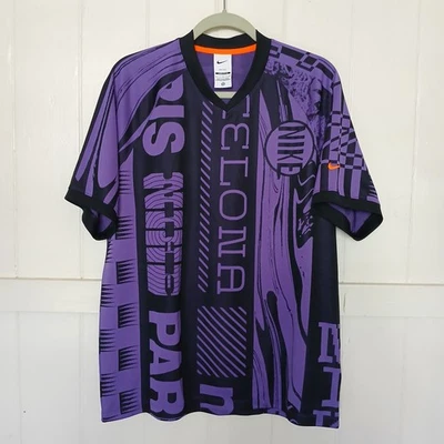 Camiseta de fútbol Nike Culture of Dri-Fit para hombre grande negra púrpura Foto 1 de 4