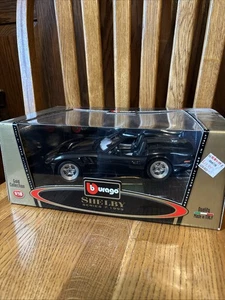 BURAGO 1999 SHELBY SERIES 1 1/18 SCALE DIE-CAST BLACK And Gold NEW IN BOX - Picture 1 of 4
