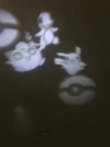 Pokémon LED Projector Light NEW INDOOR OUTDOOR White Rotate Pikachu Charmander - Picture 1 of 6