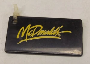 McDonald's schwarz Kunststoff Schlüsselanhänger Stück mit gelbem Logo - Bild 1 von 2