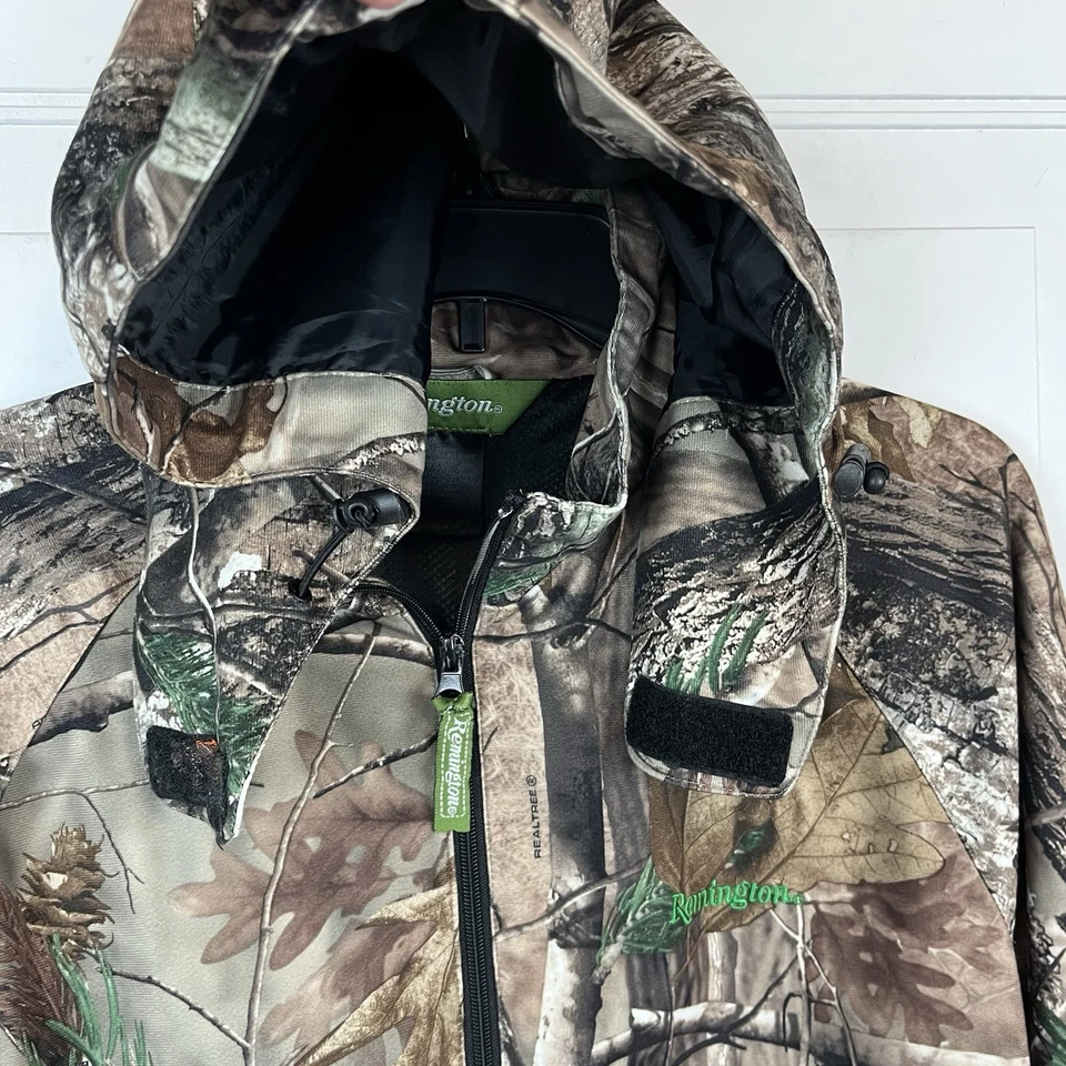 Chaqueta de Caza Remington Realtree Camuflada Para Hombres Cremallera Mediana Madera Dura Camuflaje Capucha Oculta Foto 1 de 4