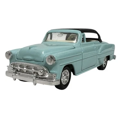 Coche diecast Welly 1953 Chevrolet Bel Air escala 1/43 aguamarina/negro puertas de apertura Foto 1 de 4