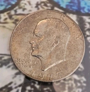 1977 Eisenhower Dollar Uncirculated $1 US Coin w/ Toning - Picture 1 of 2