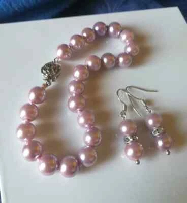 BRACCIALE PERLE AKOYA ROSA CON CHIUSURA FIORE IN ARGENTO 925 ANNODATO +ORECCHINI - Immagine 1 di 4