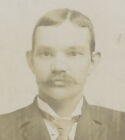 CADILLAC, MICH, PHOTO OF A MAN W/ NICE SUIT + MUSTACHE